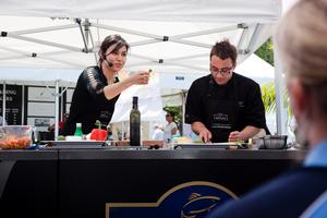 NZ's two Masterchef winners Nadia Lim and Brett McGregor demonstrate at the Regal Salmon Star Marquee